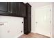 Laundry room with overhead cabinets, a utility sink, and access to the exterior at 1365 Winged Foot Dr, Denver, NC 28037