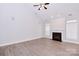Spacious living room with fireplace, neutral paint, and plantation shutters at 1365 Winged Foot Dr, Denver, NC 28037