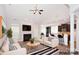 Staged living room featuring a fireplace, neutral decor, and an open layout perfect for entertaining at 1365 Winged Foot Dr, Denver, NC 28037