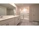 Contemporary bathroom with double vanity, sleek glass-enclosed shower, and modern fixtures at 14026 Wilson Mac Ln, Charlotte, NC 28278