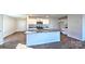 Open-concept kitchen with a granite countertop island, stainless steel appliances, and white cabinets at 14026 Wilson Mac Ln, Charlotte, NC 28278