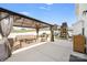 The backyard boasts a covered patio, playset, BBQ, and well-manicured lawn, great for entertaining and relaxation at 1636 Tundra Ln, Denver, NC 28037