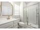 Bright bathroom with modern vanity, gold fixtures, glass shower, and natural light at 1636 Tundra Ln, Denver, NC 28037