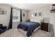 Neutral bedroom with window, framed poster art, and black-out curtains at 1636 Tundra Ln, Denver, NC 28037