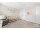 Cozy Bedroom with a white crib, plush chair, and ballet-themed wall decor at 1636 Tundra Ln, Denver, NC 28037