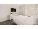 Well-lit bedroom with a TV and hardwood floors at 1636 Tundra Ln, Denver, NC 28037