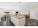 Bright kitchen with an island and granite countertops, perfect for meal prep and entertaining at 1636 Tundra Ln, Denver, NC 28037