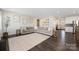Spacious living room offers a comfortable sectional sofa and seamless access to the kitchen and dining area at 1636 Tundra Ln, Denver, NC 28037