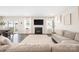 Comfortable living room showcasing a fireplace, large windows, and seamlessly flowing into the dining area at 1636 Tundra Ln, Denver, NC 28037