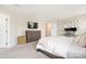 Large bedroom with a TV, dresser, and a comfortable office space at 1636 Tundra Ln, Denver, NC 28037