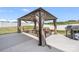 Cozy covered patio with comfortable seating, a barbecue, and well-maintained concrete flooring at 1636 Tundra Ln, Denver, NC 28037