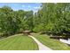 Aerial view of the backyard featuring a lush lawn, a gazebo, and surrounding trees at 1655 Buckland Ct, Indian Land, SC 29707