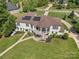 Impressive home boasts a well-manicured lawn, deck, and inviting outdoor space at 1655 Buckland Ct, Indian Land, SC 29707