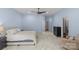 Spacious bedroom with a large bed, neutral tones, a ceiling fan, a dresser, chair and carpeted floors at 1655 Buckland Ct, Indian Land, SC 29707