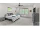 Cozy bedroom with carpeted floors, natural light, and a ceiling fan at 1655 Buckland Ct, Indian Land, SC 29707