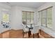 Bright breakfast nook with wood floors, natural light, and access to the outdoors at 1655 Buckland Ct, Indian Land, SC 29707