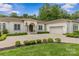 Elegant house with a well-manicured lawn, beautiful landscaping, and a neutral palette, enhancing its luxurious appeal at 1655 Buckland Ct, Indian Land, SC 29707