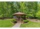 Picturesque gazebo nestled in the backyard surrounded by lush greenery at 1655 Buckland Ct, Indian Land, SC 29707