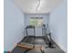 Home gym with a treadmill, stationary bike and bench press and rubber floors creating a fitness space at 1655 Buckland Ct, Indian Land, SC 29707