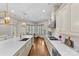 Bright kitchen featuring a center island with seating, modern appliances, and ample counter space ideal for cooking at 1655 Buckland Ct, Fort Mill, SC 29707