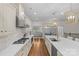 Spacious kitchen featuring a large island with seating, modern appliances, and a view into the dining area at 1655 Buckland Ct, Indian Land, SC 29707