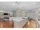 Open concept living area features hardwood floors, modern light fixtures, and natural light at 1655 Buckland Ct, Indian Land, SC 29707