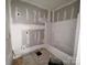Bathroom with new tub/shower combo, and partially finished walls, awaiting final touches at 1703 Lowder St, Albemarle, NC 28001