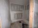 Bathroom with new tub/shower combo, and partially finished walls, ready for completion at 1703 Lowder St, Albemarle, NC 28001