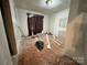 Bedroom under renovation with unfinished walls and hardwood floors, ready for renovation at 1703 Lowder St, Albemarle, NC 28001