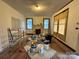 Bright living room with a vintage fireplace, hardwood floors and abundant natural light at 1703 Lowder St, Albemarle, NC 28001