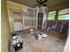 Unfinished living room with bare floors and painting supplies at 1703 Lowder St, Albemarle, NC 28001