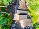 This aerial view showcases the roof of the house and the lush green landscaping at 173 Greenridge Rd, Lake Wylie, SC 29710