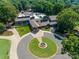 A circle driveway in front of a large building that has a fountain in the center of the green space at 173 Greenridge Rd, Lake Wylie, SC 29710