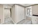 Hallway with tile flooring, closet, and staircase, offering convenient access to different areas of the home at 173 Greenridge Rd, Lake Wylie, SC 29710