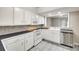 Well-lit kitchen featuring white cabinetry, black countertops, and stainless steel appliances at 173 Greenridge Rd, Lake Wylie, SC 29710