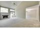 Bright and open living room featuring a fireplace, vaulted ceilings, and sliding glass door to the backyard at 173 Greenridge Rd, Lake Wylie, SC 29710