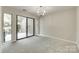 Bright living room featuring sliding glass doors to the backyard at 173 Greenridge Rd, Lake Wylie, SC 29710