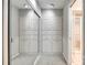 Mirrored closet doors with built-in white cabinets and shelves maximizing space in this modern walk-in closet at 173 Greenridge Rd, Lake Wylie, SC 29710