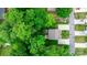 Bird's eye view showcases the property's roof, driveway, backyard garden, and surrounding lush greenery at 1735 15Th Street Ne Pl, Hickory, NC 28601