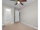 Neutral bedroom with carpeted floors, a ceiling fan, and a walk-in closet with additional storage space at 1735 15Th Street Ne Pl, Hickory, NC 28601