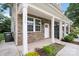 Charming home exterior featuring stone accents, white columns, and a welcoming front porch at 1735 15Th Street Ne Pl, Hickory, NC 28601