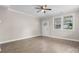 Living room with hardwood floors, ceiling fan, and a decorative front door at 1735 15Th Street Ne Pl, Hickory, NC 28601