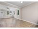 A bright, spacious living room with hardwood floors, neutral walls, and multiple windows at 1735 15Th Street Ne Pl, Hickory, NC 28601