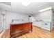 Basement featuring wood-look flooring, bed, fridge, sink, microwave, and oven at 174 Wintergreen Cir, Statesville, NC 28677