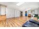 Spacious basement featuring wood-look flooring, ample lighting and extra storage space with access to another room at 174 Wintergreen Cir, Statesville, NC 28677