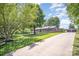 A beautiful single-story brick home with a lush green lawn and mature trees at 174 Wintergreen Cir, Statesville, NC 28677