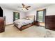 Bright and airy main bedroom featuring plush bed, neutral colors, and sunlit windows at 174 Wintergreen Cir, Statesville, NC 28677