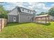 A spacious backyard with a well-maintained lawn and a covered patio area attached to the house at 1832 Montclair Ave, Gastonia, NC 28054
