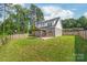Expansive backyard with lush green grass and an impressive pergola at 1832 Montclair Ave, Gastonia, NC 28054