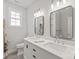 Bathroom featuring double sinks, modern fixtures and tile floor at 1832 Montclair Ave, Gastonia, NC 28054